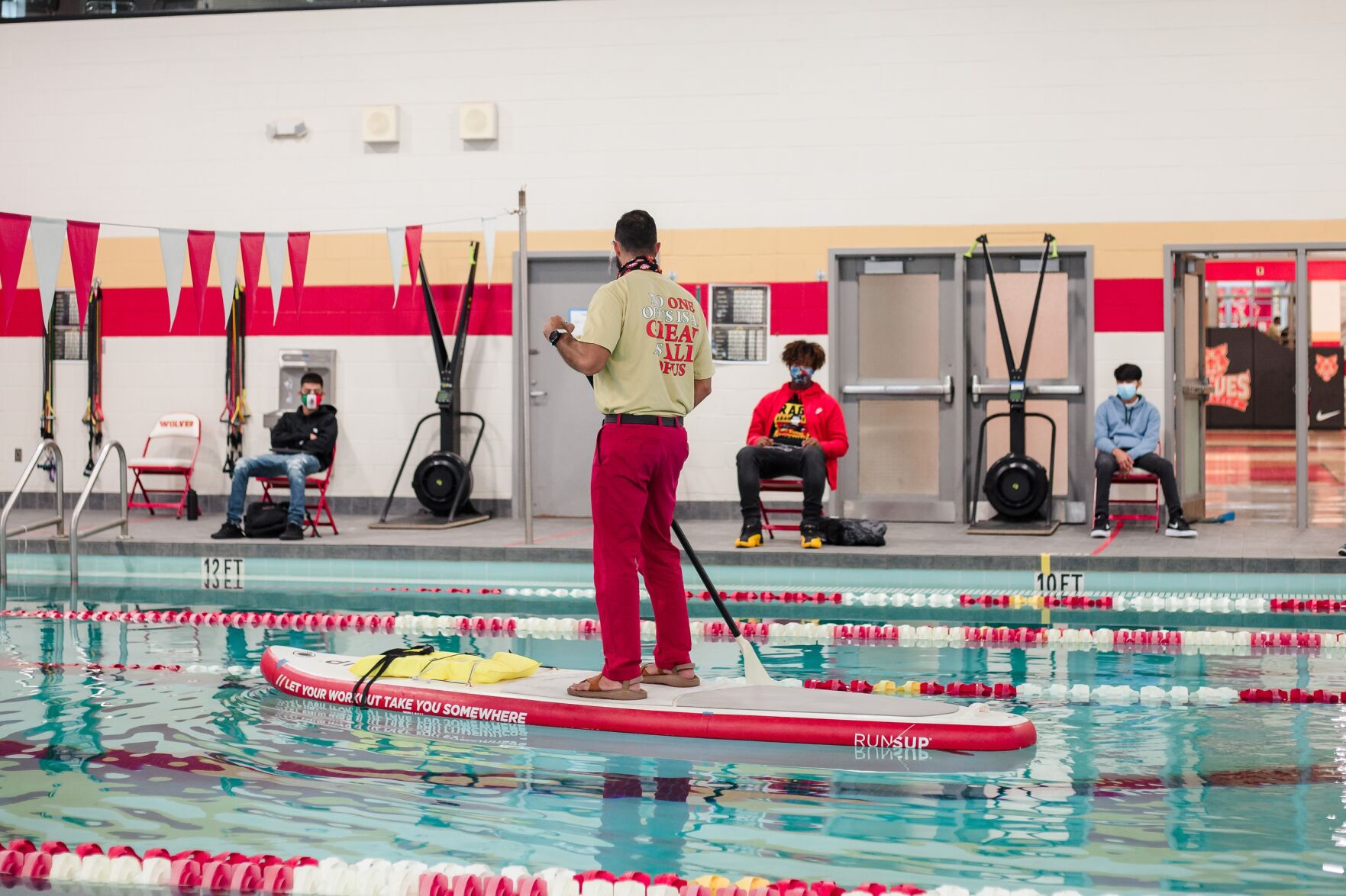 Teaching pool safety from a paddle board at Rome High School
